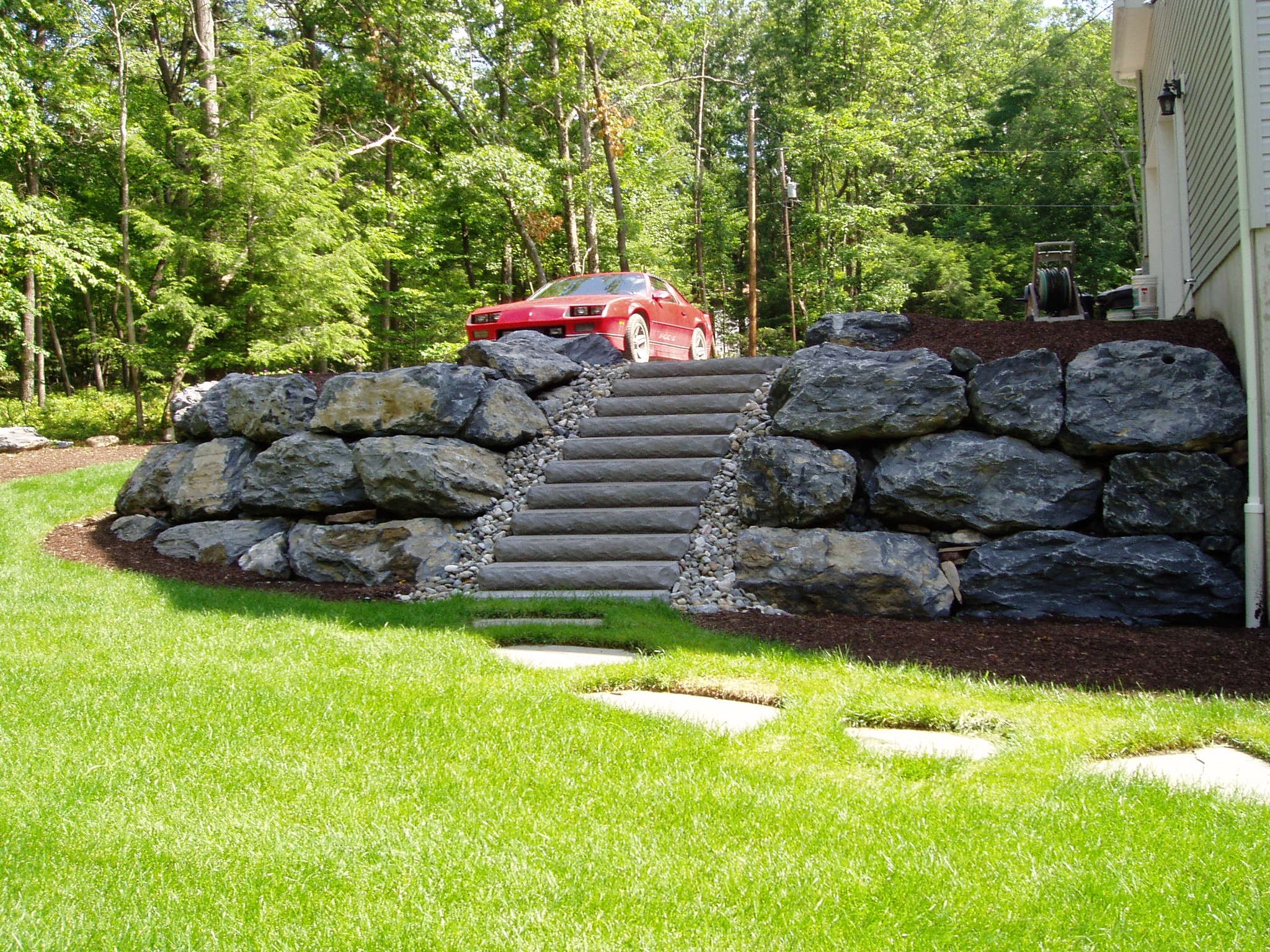Boulder, grading, stair and flagstone landscape design build
