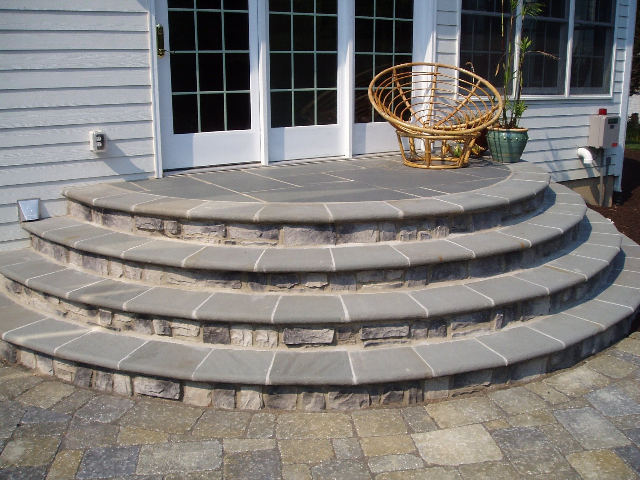 Stone and curved patio stairs landscape design and construction